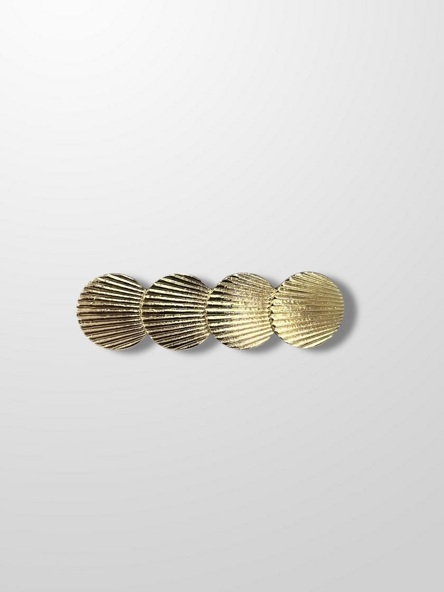 Broche dorado conchas